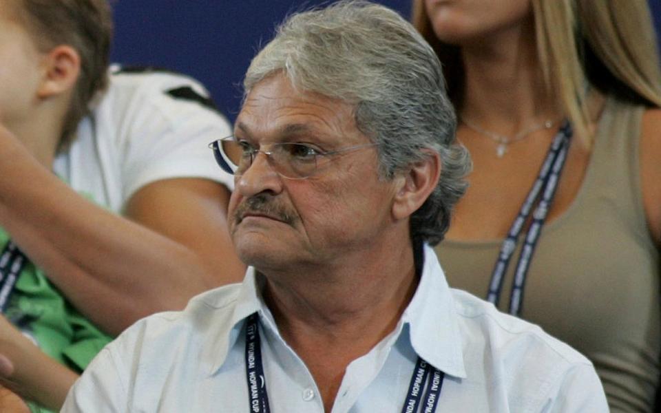 Nikolaos Philippoussis sits in the stands watching his son, Mark Philippoussis, play in 2005 - Credit: AP