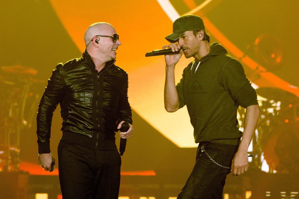 Pitbull and Enrique Iglesias perform onstage at Allstate Arena on February 20, 2015 in Rosemont, Ill.