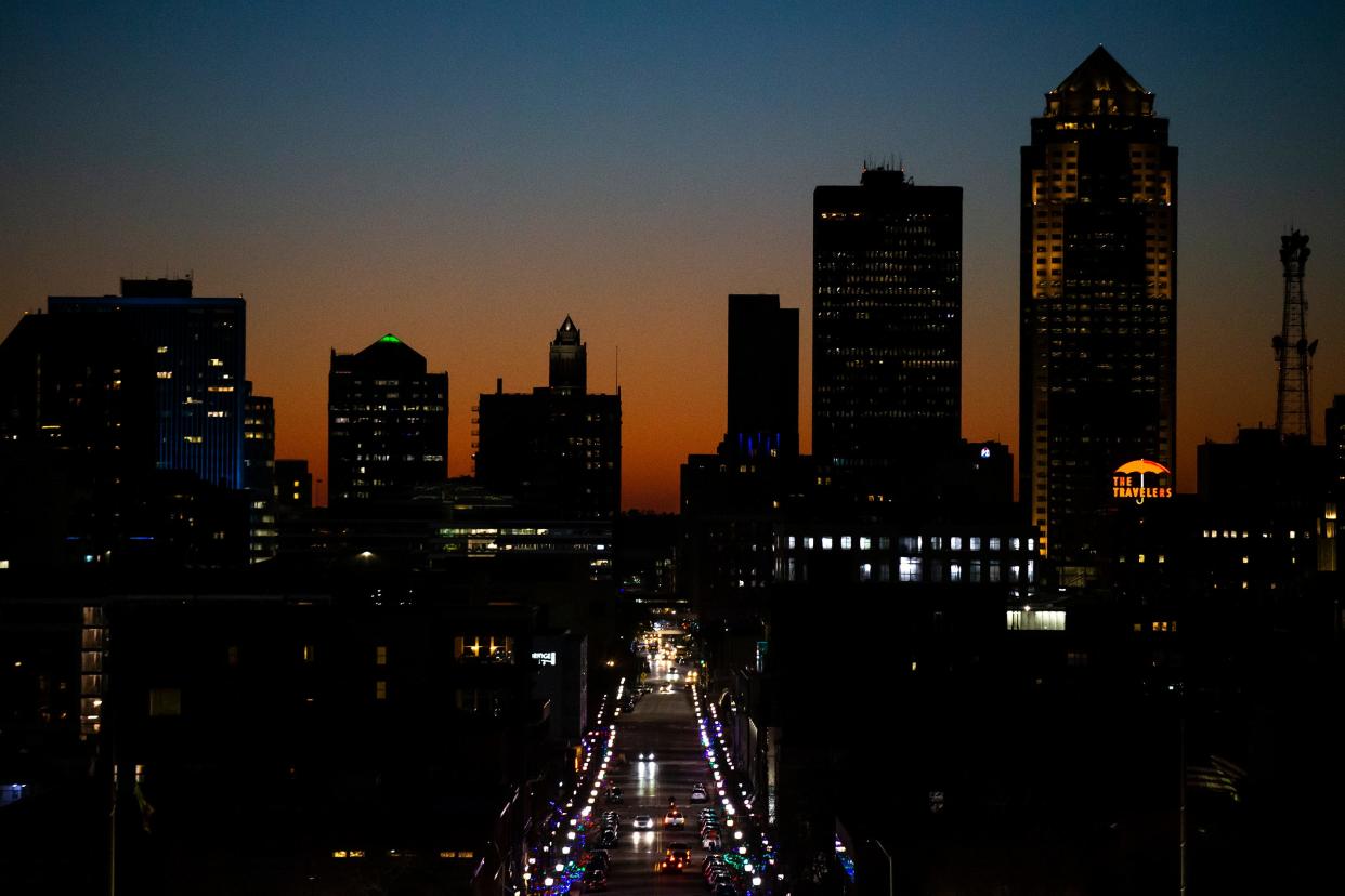 The sunsets behind the Des Moines skyline, on Tuesday, Nov. 23, 2021. 