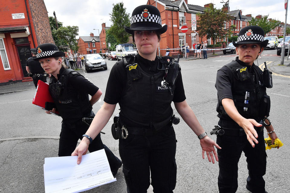 <p>Police put up a corden as they attend the scene of a raid in the Moss Side area as part of their ongoing investigation following the terror attack earlier this week on May 27, 2017 in Manchester, England. The Manchester Arena suicide bombing killed 22 people on the evening of May 22 as concert goers were leaving the venue after an Ariana Grande performance. (Photo: Anthony Devlin/Getty Images) </p>