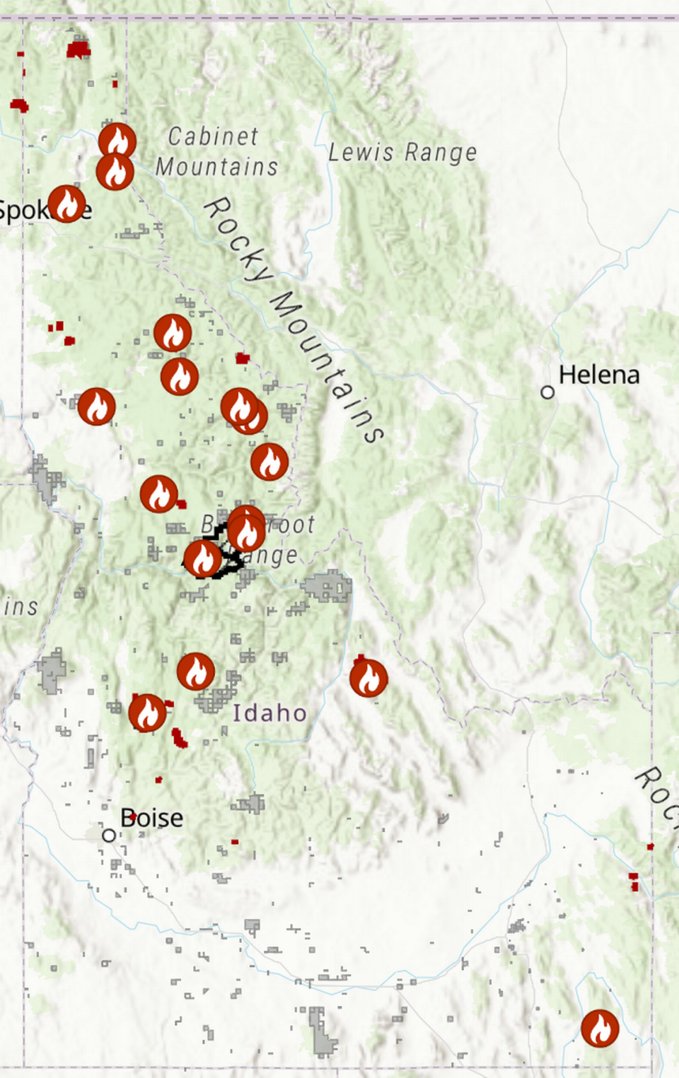 This wildfire map shows the locations of active wildfires in red, and the perimeters of previous wildfires that are now extinguished and will exhibit burn scars in grey.