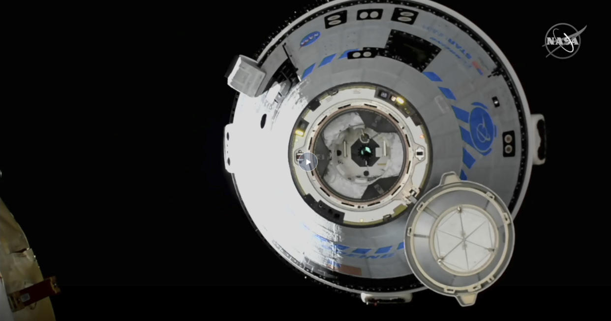 This image from NASA TV shows the Boeing Starliner approaching the International Space Station, Friday, May 20, 2022. Boeing's astronaut capsule has arrived at the International Space Station in a critical repeat test flight. Only a test dummy was aboard the capsule for Friday's docking, a huge achievement for Boeing after years of false starts. (NASA via AP)