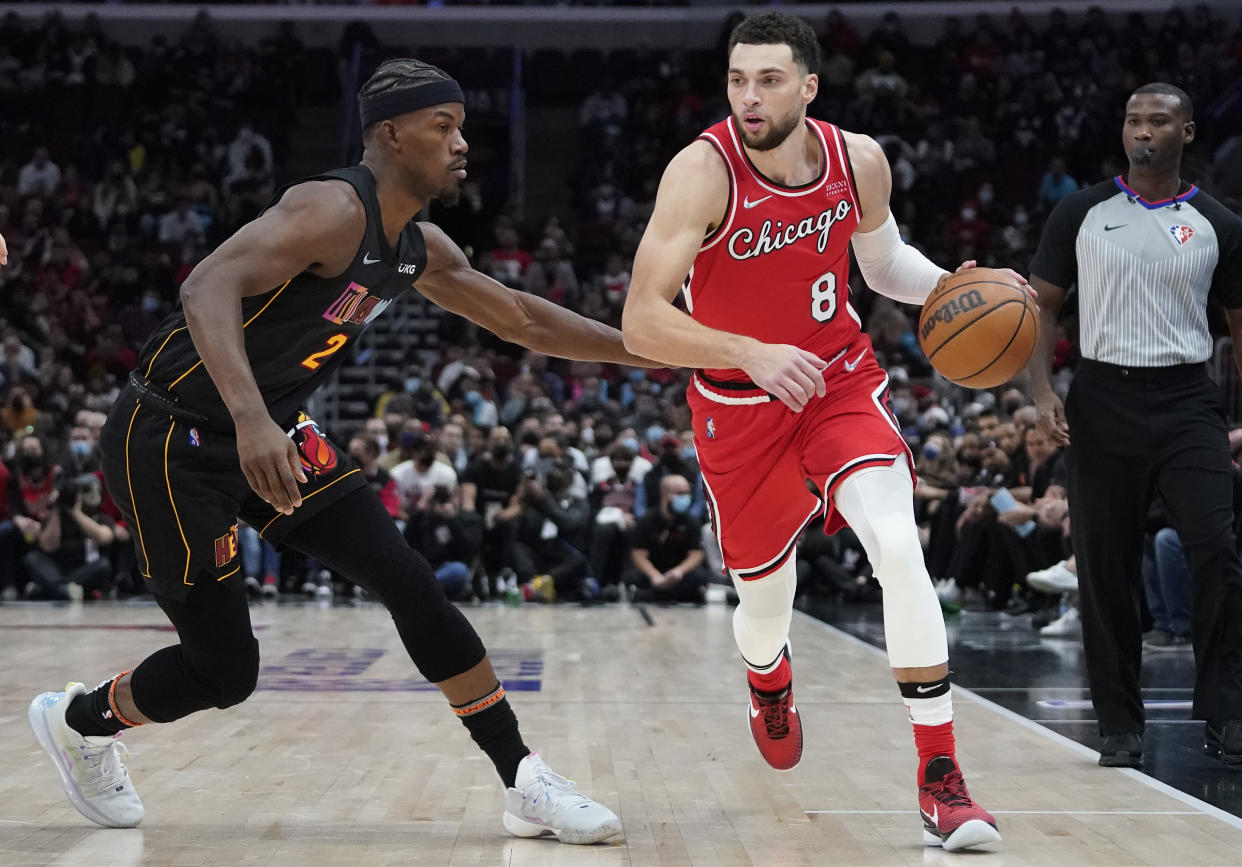 Chicago Bulls guard Zach LaVine moves around Miami Heat forward Jimmy Butler.