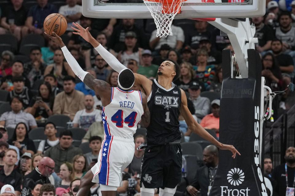 Philadelphia 76ers forward Paul Reed (44) goes up against San Antonio Spurs center Victor Wembanyama (1) in the first half at Frost Bank Center in San Antonio on April 7, 2024.
