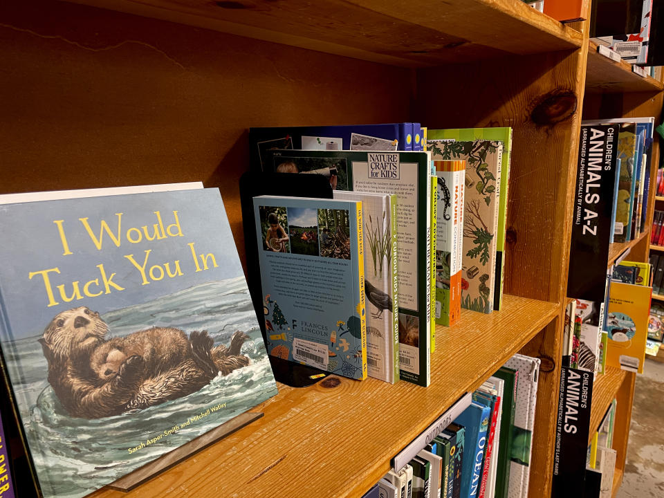The children's book "I Would Tuck You In," illustrated by Mitchell Thomas Watley, is shown at a bookstore in Portland, Ore. in this April 5, 2023 photo. Publisher Sasquatch books, owned by Penguin Random House, said Wednesday, April 5, 2023, it has ended its publishing relationship with Watley after he was arrested on allegations of leaving violent, transphobic notes in stores around Juneau, Alaska. Watley told police he was motivated by fear following a deadly school shooting in Nashville that sparked online backlash about the shooter's gender identity, court records show. (AP Photo/Claire Rush)
