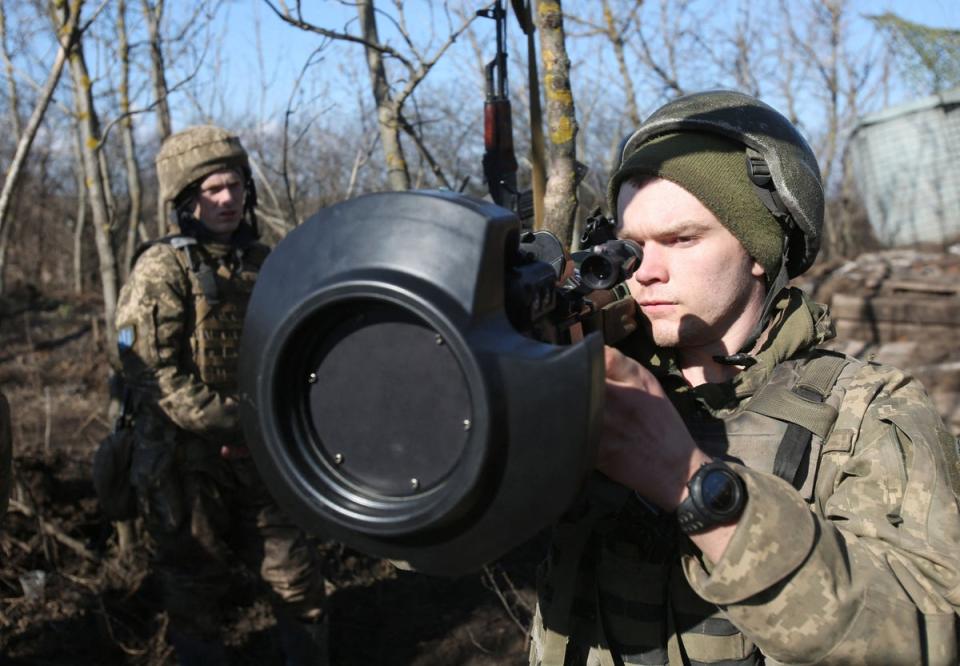 Servicemen of Ukrainian Military Forces on the front-line with Russia-backed separatists near Novognativka village, Donetsk region, examine a Swedish-British portable anti-tank guided missile (AFP/Getty)