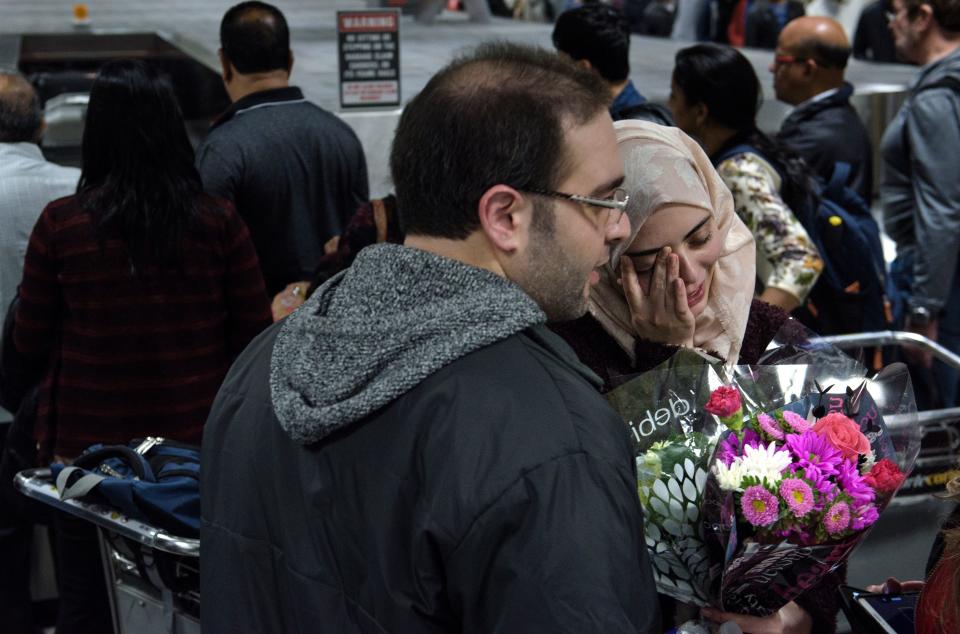 Dr. Muhamad Alhaj Moustafa and his wife Nabil Alhaffar, both Syrian citizens, meet after she returned from a trip to Doha, Qatar. She was denied re-entry in January at the international arrivals hall at Washington Dulles International Airport on Feb. 6, 2017.