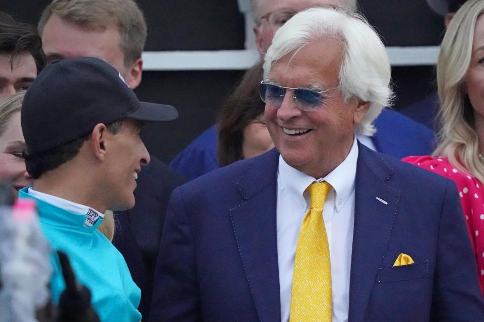 National Treasure trainer Bob Baffert, right, and jockey John Velazquez in the winner's circle following their victory in the 148th running of the Preakness Stakes at Pimlico Race Course on May 20, 2023; Baltimore, Maryland.