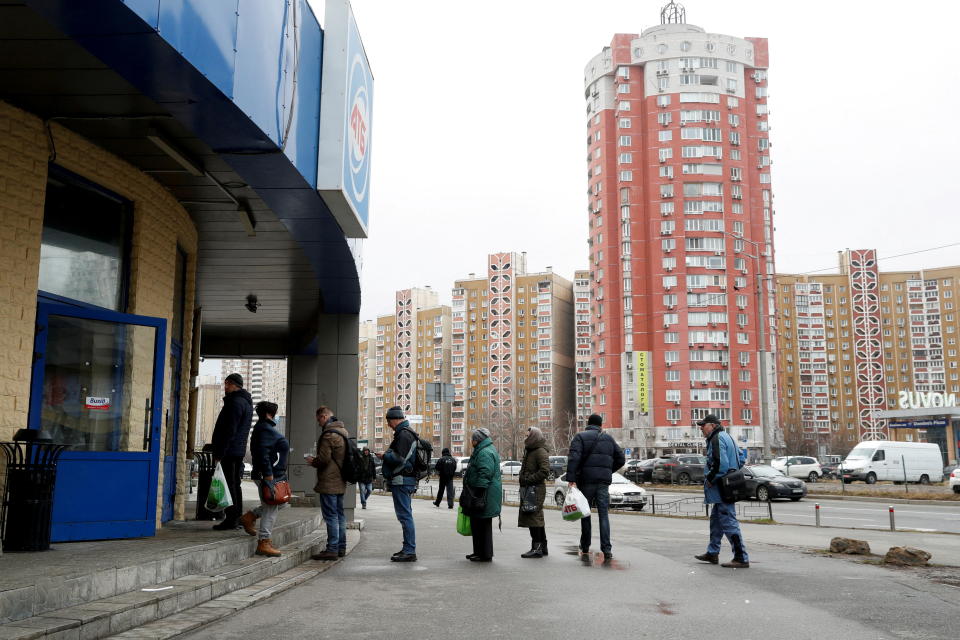 People line up in front of a supermarket, as Russia's invasion of Ukraine continues, in Kyiv, Ukraine March 1, 2022. REUTERS/Valentyn Ogirenko