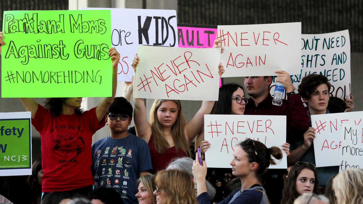 Protesters attend a rally at the Federal Courthouse in Fort Lauderdale, Fla., to demand government action on firearms, on Saturday, Feb. 17, 2018. Their call to action is a response the massacre at Marjory Stoneman Douglas High School in Parkland, Fla. (Photo: Mike Stocker/Sun Sentinel/TNS)