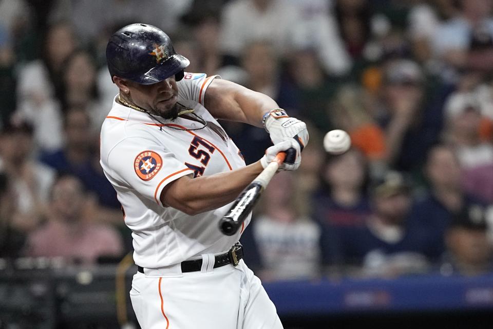 Houston Astros' Jose Abreu hits a sacrifice fly during the second inning of a baseball game against the Los Angeles Angels Thursday, June 1, 2023, in Houston. (AP Photo/David J. Phillip)