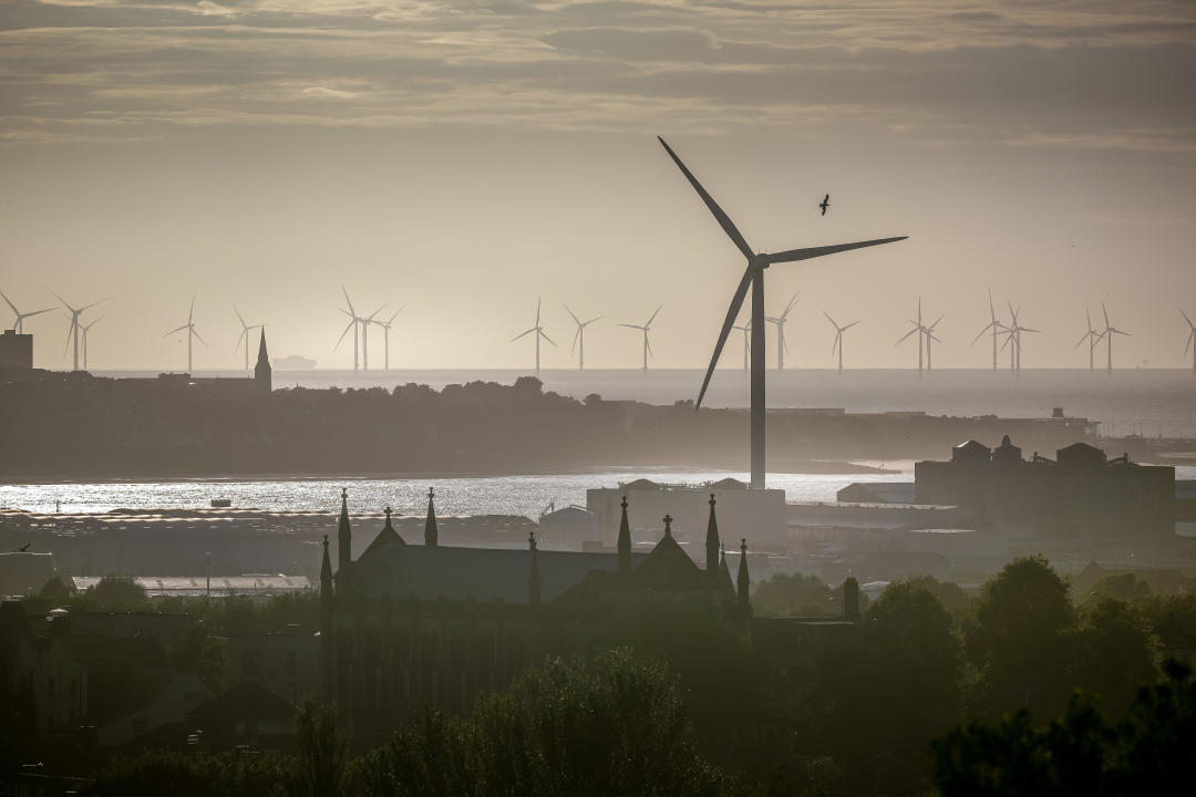 LIVERPOOL, UNITED KINGDOM - AUGUST 03: A view across the River Mersey estuary showing New Brighton and the Burbo Bank wind farm on August 03, 2024 in Liverpool, United Kingdom. (Photo by Christopher Furlong/Getty Images)