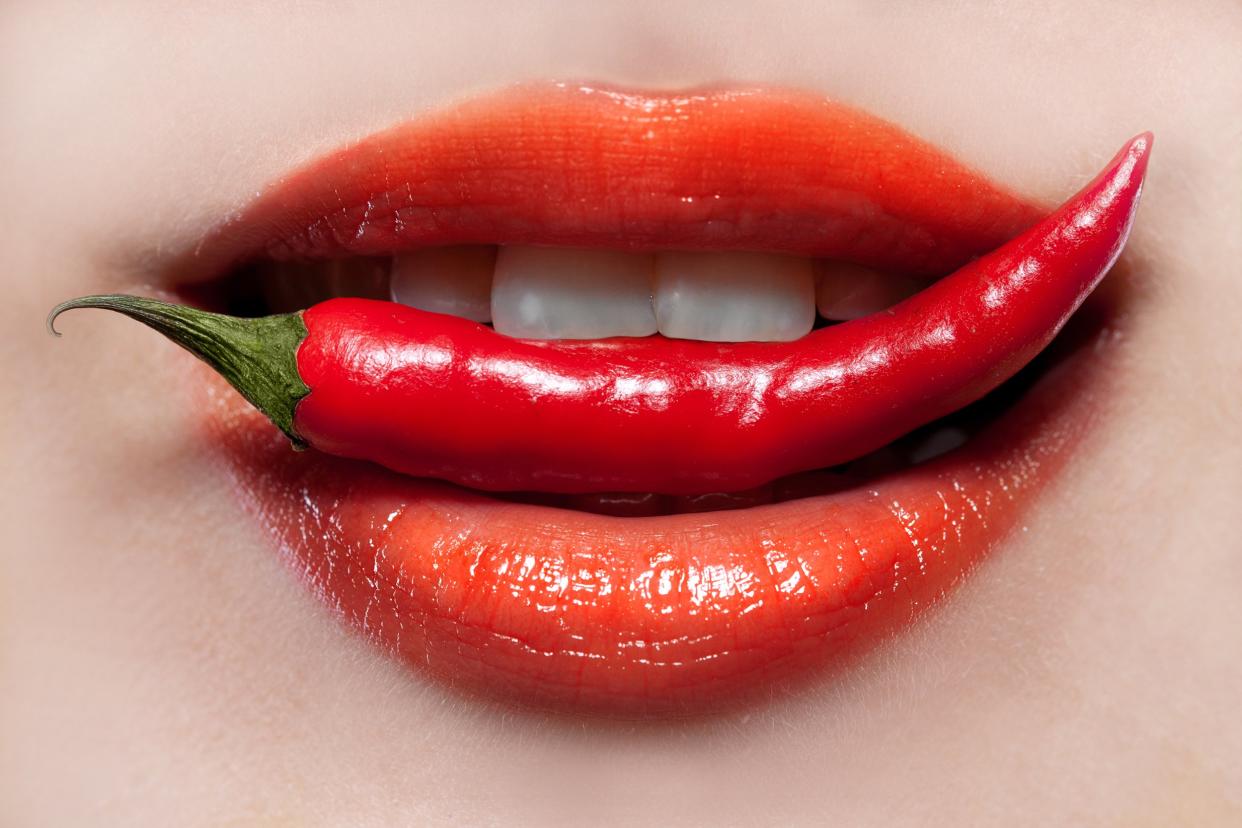 woman lips and chili pepper