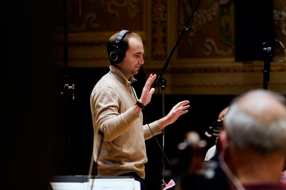 Conductor Daniel Slatkin, works on a score with the Detroit Symphony Orchestra for the documentary 'Gradually, Then Suddenly: The Bankruptcy of Detroit' at the DSO in Detroit on Dec. 6, 2021.