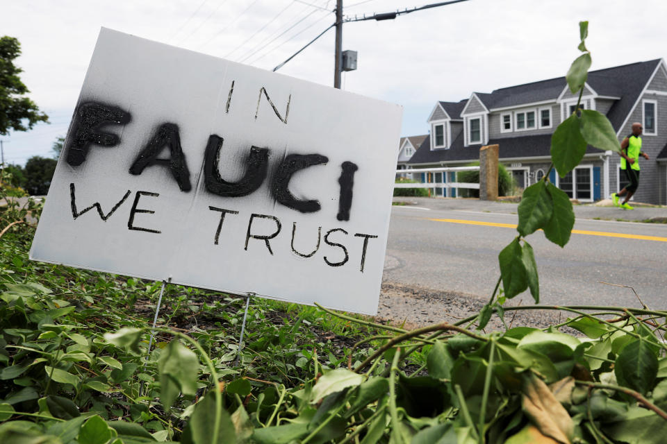 A sign reads "In Fauci We Trust," referring to the director of the National Institute of Allergy and Infectious Diseases Anthony Fauci, outside a home in Rockport, Massachusetts, U.S., July 13, 2020.   REUTERS/Brian Snyder