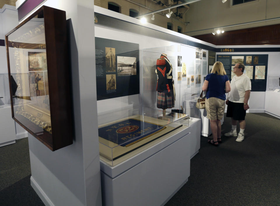 In this Wednesday, June 26, 2013 photo, Jerry and Ellen Davino, of River Edge, N.J., visit the New York State Military Museum, in Saratoga Springs, N.Y. The exhibit, titled "New York in the Civil War," will be a permanent part of the museum, which tells New York's military history from the Revolutionary War to the Iraq and Afghanistan wars. (AP Photo/Mike Groll)