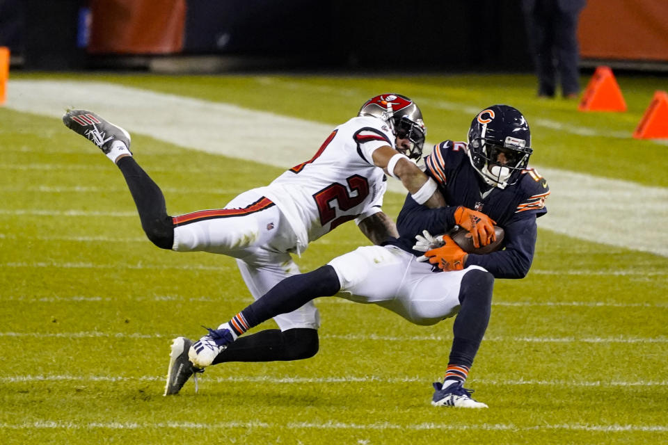 Tampa Bay Buccaneers cornerback Carlton Davis (24) tackles Chicago Bears wide receiver Allen Robinson (12) after a catch during the second half of an NFL football game in Chicago, Thursday, Oct. 8, 2020. (AP Photo/Nam Y. Huh)