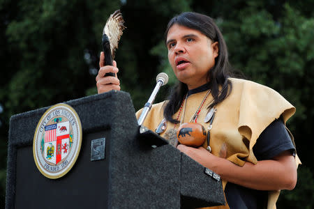 Andrew "Guiding Young Cloud" Morales takes part in a sunrise celebration during the inaugural Indigenous People's Day in downtown Los Angeles after the Los Angeles City Council voted to establish the second Monday in October as "Indigenous People's Day", replacing Columbus Day, in Los Angeles, California, U.S., October 8, 2018. REUTERS/Mike Blake