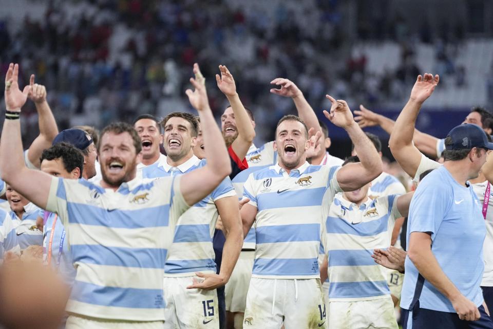 Argentina's Emiliano Boffelli, center right, celebrates with teammates at the end of the Rugby World Cup quarterfinal match between Wales and Argentina at the Stade de Marseille in Marseille, France, Saturday, Oct. 14, 2023. (AP Photo/Pavel Golovkin)
