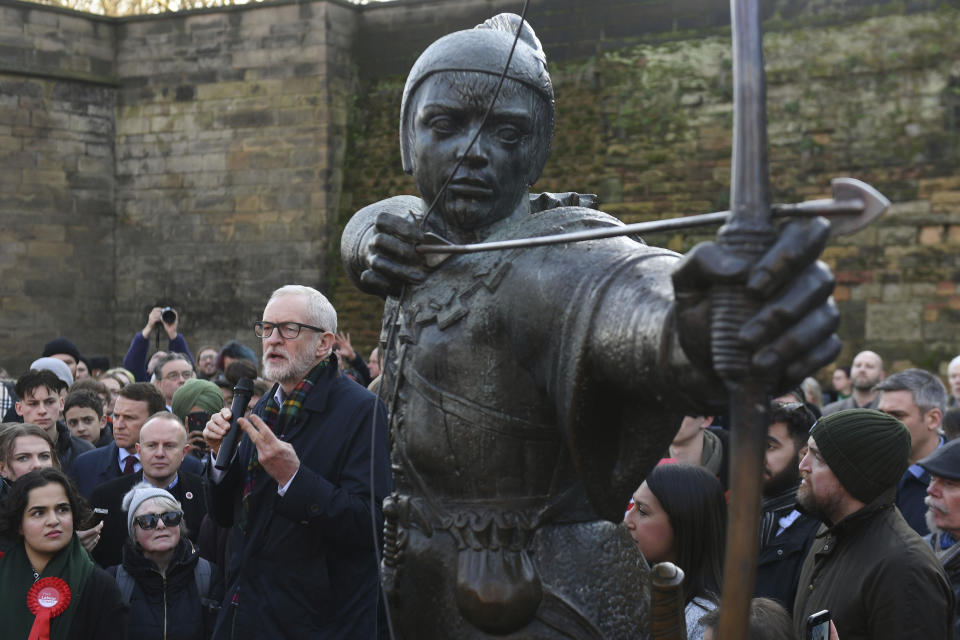 Jeremy Corbyn speaks to a crowd of supporters, next to a statue of heroic outlaw Robin Hood in Nottingham.