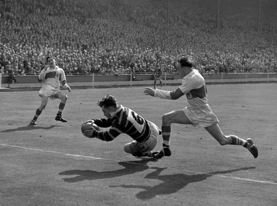 Peter Ramsden scores the winning try to give Huddersfield victory in the 1953 Challenge Cup final at Wembley (PA Archive) (PA Archive)