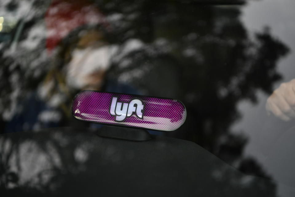 IMAGE DISTRIBUTED FOR LYFT - In this image distributed on Thursday, Feb. 9, 2017, Lyft’s new Amp glows on the dashboard of a car in San Francisco. (Josh Edelson/AP Images for Lyft)