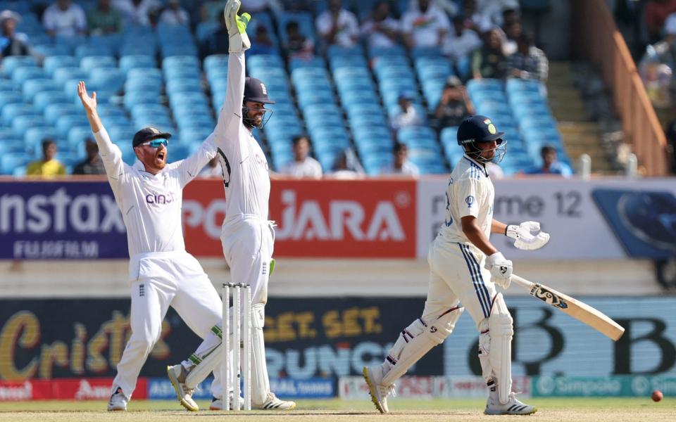 England's Ben Foakes and Jonny Bairstow appeal for the wicket of India's Kuldeep Yadav