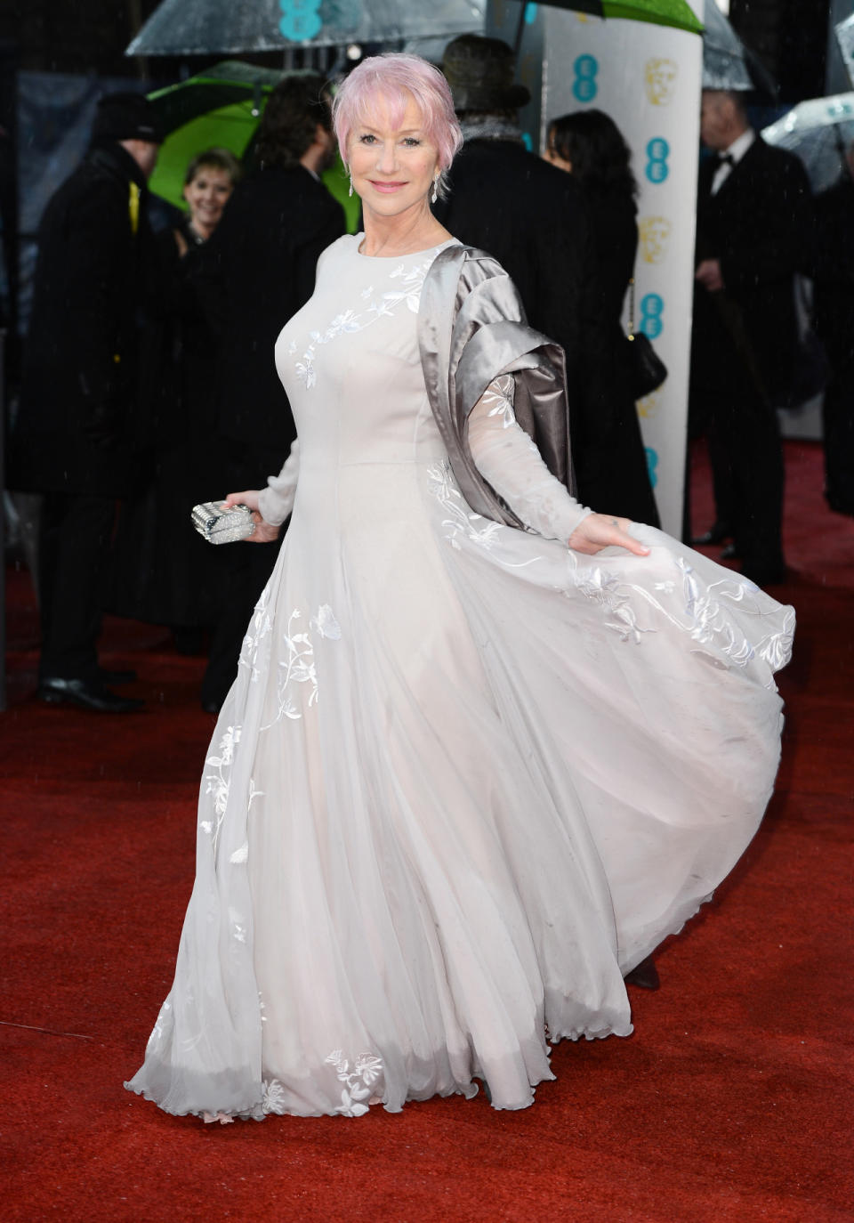 Clad in an embroidered Nicholas Oakwell dress, it’s Mirren’s fabulous pink pixie cut that steals the show in this shot. <i>[Photo: Getty]</i>