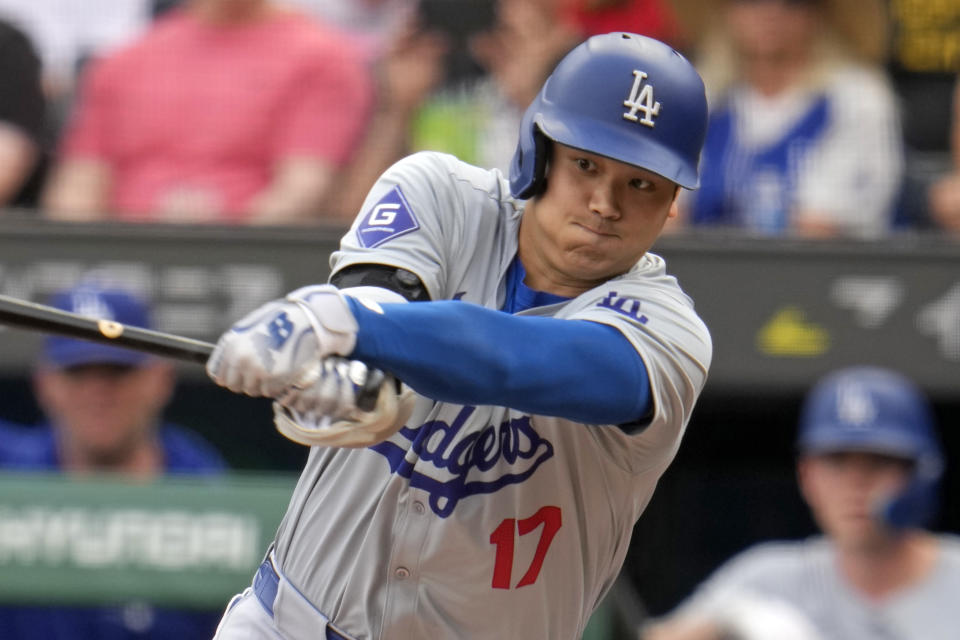 Los Angeles Dodgers' Shohei Ohtani swings at a third strike during the first inning of the team's baseball game against the Pittsburgh Pirates in Pittsburgh, Tuesday, June 4, 2024. (AP Photo/Gene J. Puskar)