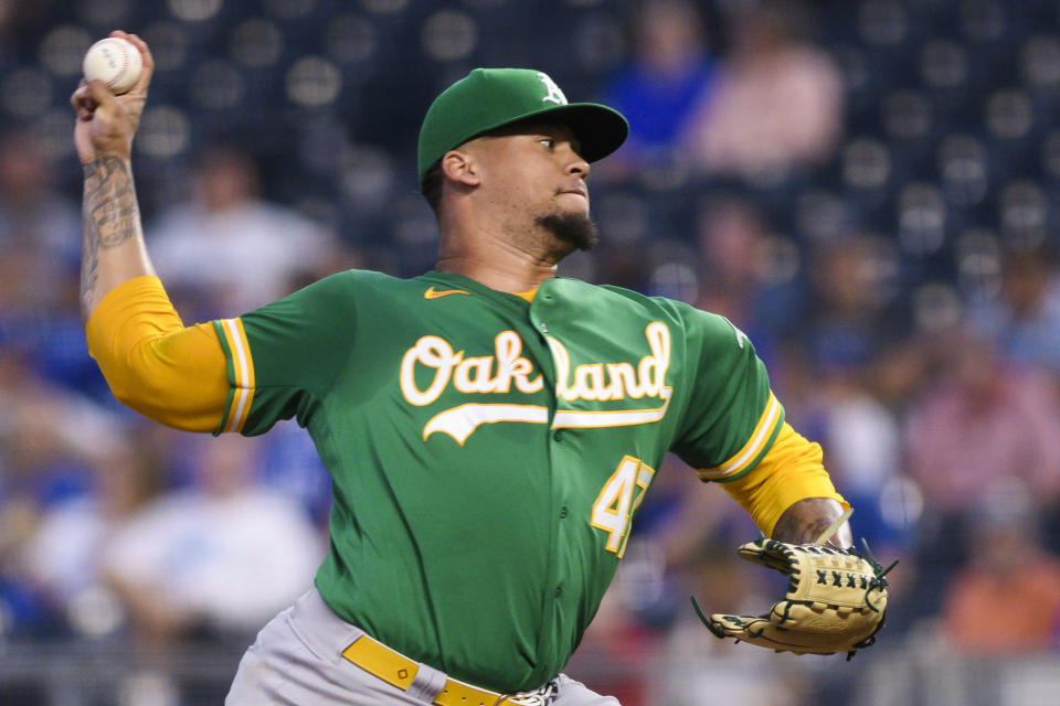 Oakland Athletics starting pitcher Frankie Montas throws to a Kansas City Royals batter during the first inning of a baseball game, Tuesday, Sept. 14, 2021 in Kansas City, Mo. (AP Photo/Reed Hoffmann)