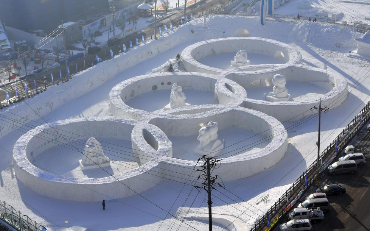 A snow sculpture of the Olympic Rings near the venue for the opening and closing ceremonies of the Pyeongchang 2018 Winter Olympic Games - AFP or licensors