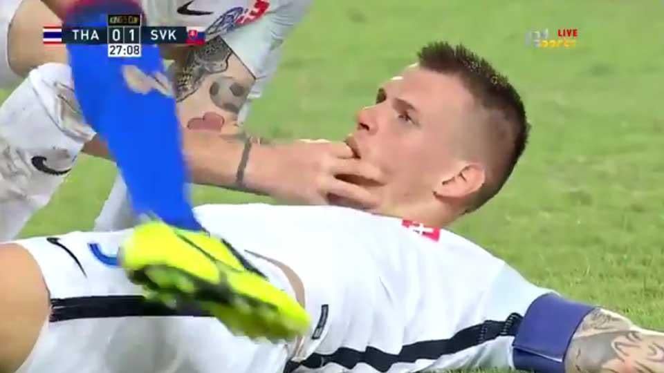 Worrying moment: Martin Skrtel is saved from swallowing his tongue – but plays on