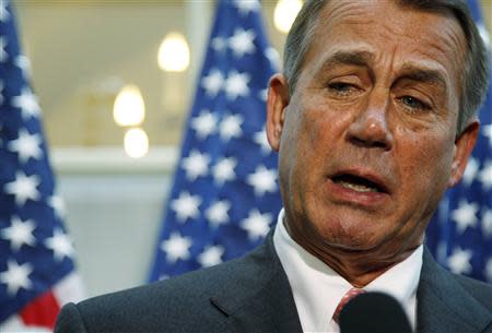 U.S. House Speaker John Boehner (R-OH) (C) addresses reporters at the U.S. Capitol in Washington, October 10, 2013. REUTERS/Jonathan Ernst