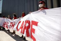 Laid off LAX Airport workers protest for a healthcare extension from concessions companies, in Los Angeles