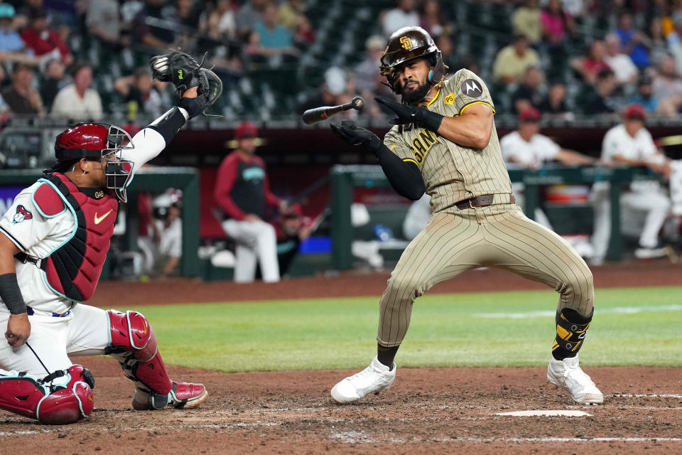 San Diego Padres outfielder Fernando Tatis Jr. dodges a pitch during the ninth inning against the Arizona Diamondbacks.