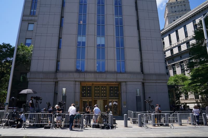 Media wait outside federal court for a bail hearing in the Ghislaine Maxwell case in the Manhattan borough of New York City