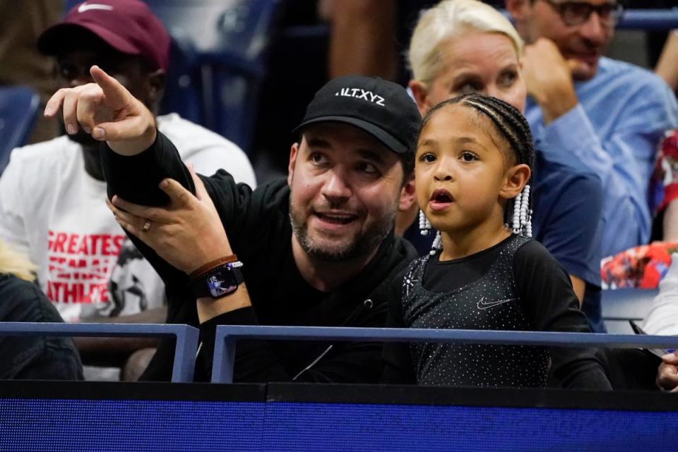 Serena Williams’ husband Alexis Ohanian and daughter Olympia watch from the stands (John Minchillo/AP) (AP)