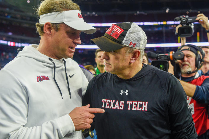 HOUSTON, TX - DECEMBER 28: Mississippi Rebels head coach Lane Kiffin and Texas Tech Red Raiders head coach Joey McGuire chat near midfield following the TaxAct Texas Bowl between the Texas Tech Red Raiders and Ole Miss Rebels at NRG Stadium on December 28, 2022 in Houston, Texas. (Photo by Ken Murray/Icon Sportswire via Getty Images)