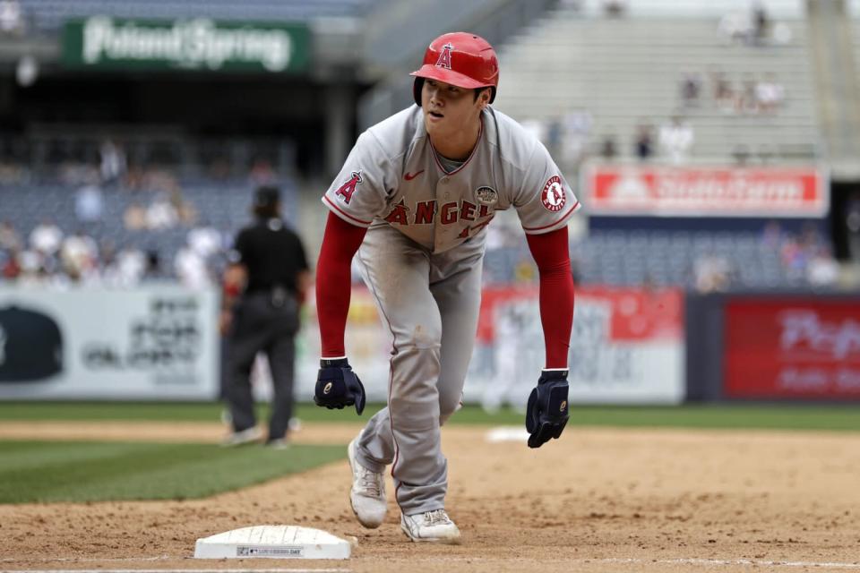 Shohei Ohtani reacts after being picked off first base during the fifth inning.