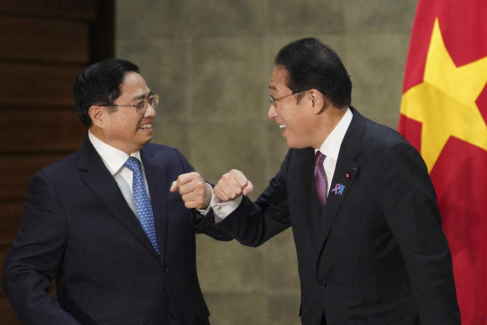 Vietnam's Prime Minister Pham Minh Chinh, left, greets Japan's Prime Minister Fumio Kishida, at the prime minister's official residence in Tokyo, Japan, on Wednesday, Nov. 24, 2021.(Toru Hanai/Pool Photo via AP)