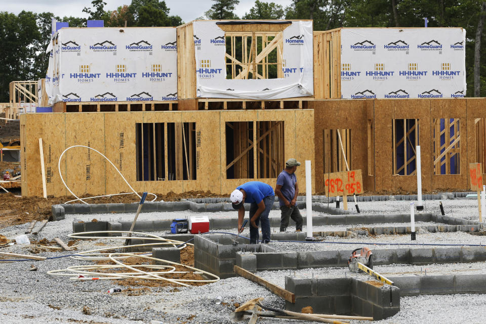 In this June 13, 2019, photo work continues on a new multifamily townhouse home in Mechanicsville, Va. On Monday, July 1, the Commerce Department reports on U.S. construction spending in May. (AP Photo/Steve Helber)