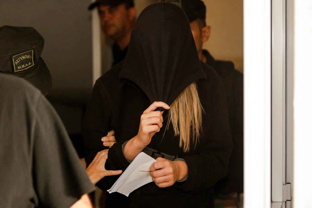 This picture taken on July 30, 2019 shows a British teenager who accused seven Israelis of gang rape leaving the Famagusta District Court in Paralimni in eastern Cyprus. - Initially, the 19-year-old woman had alleged that 12 Israelis gang raped her at the hotel where she was staying in the popular Ayia Napa resort on July 17. The young Israeli tourists were remanded in custody the next day. But hours before their second appearance in court five of them were released and sent home late the next day. (Photo by Matthieu CLAVEL / AFP)        (Photo credit should read MATTHIEU CLAVEL/AFP/Getty Images)