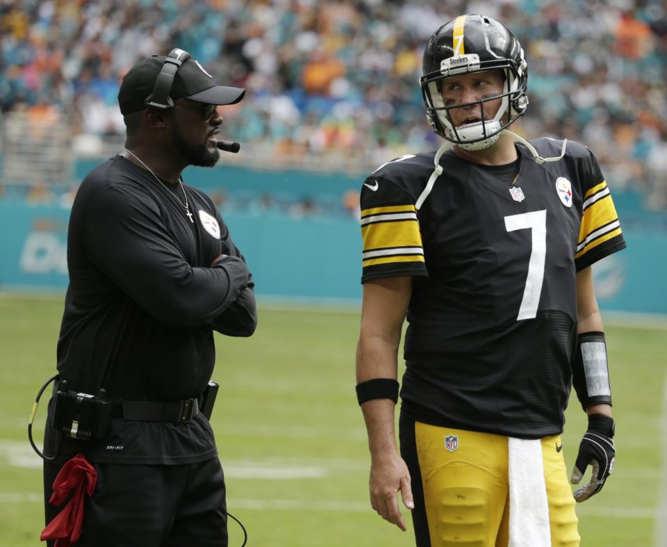 Mike Tomlin, left, and Ben Roethlisberger discuss what went wrong for the Pittsburgh Steelers against the Miami Dolphins. (AP)