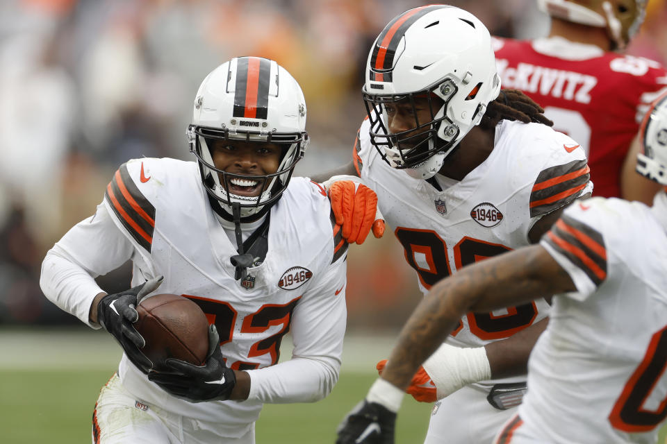 Cleveland Browns cornerback Martin Emerson Jr., left, is congratulated by defensive end Za'Darius Smith after intercepting a pass against the San Francisco 49ers during the second half of an NFL football game Sunday, Oct. 15, 2023, in Cleveland. (AP Photo/Ron Schwane)