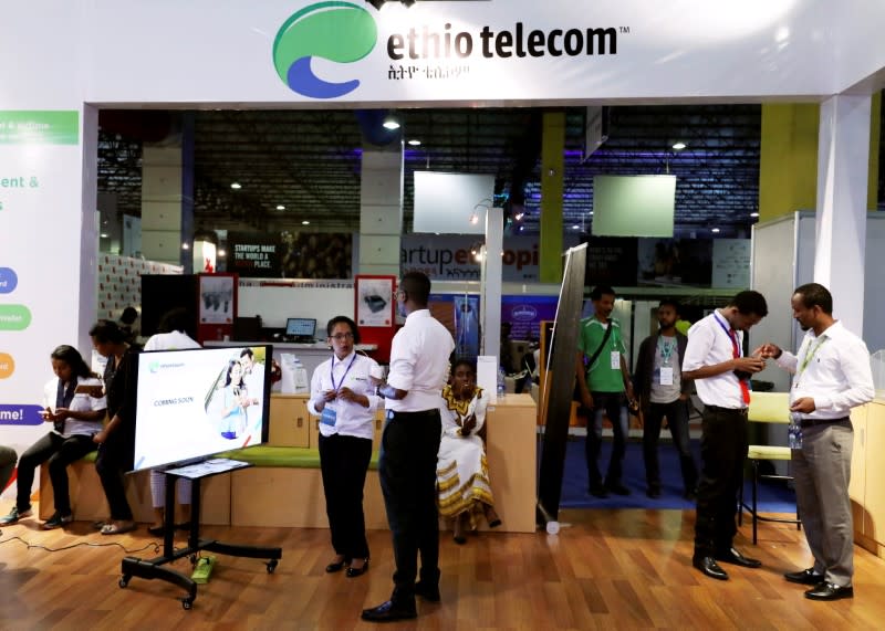 FILE PHOTO: Customers receive assistance from staff members at an Ethio Telecom branch in Addis Ababa