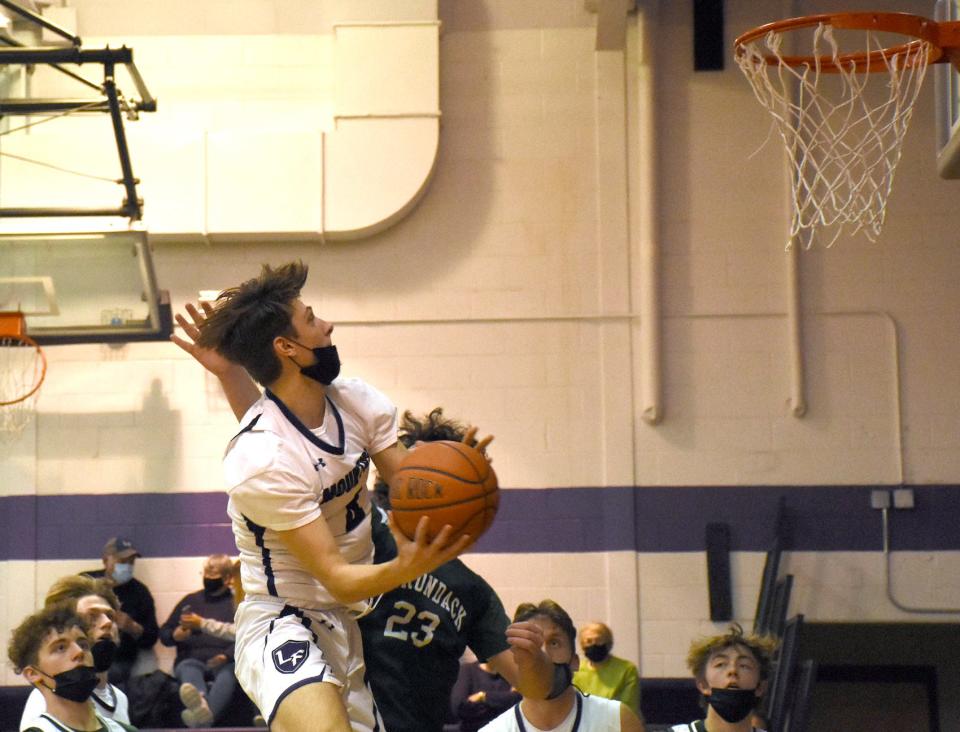 Little Falls Mountie Colten Frederick attacks the basket during the second half of Thursday's game against Adirondack.