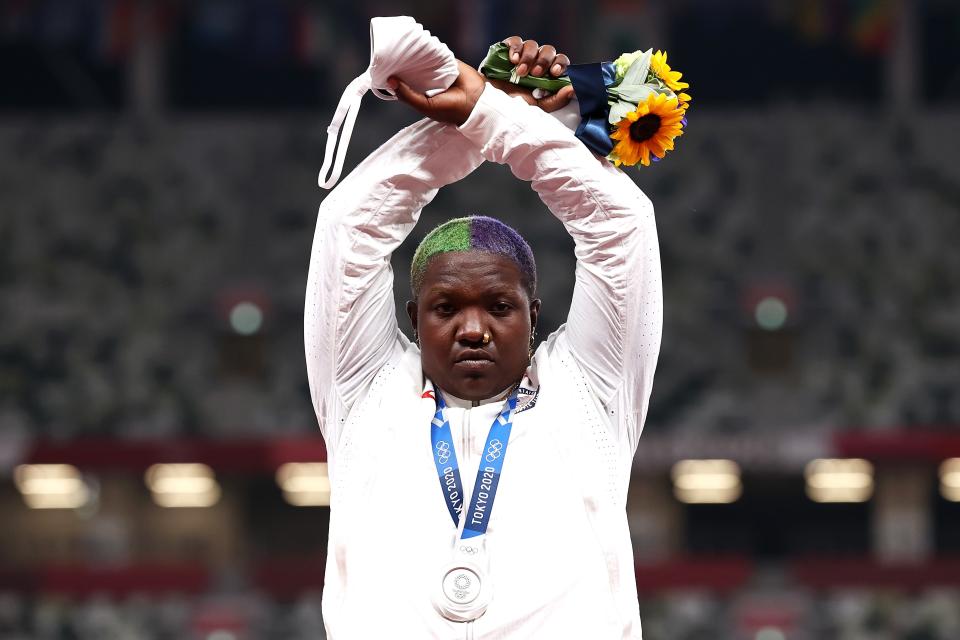 American shot-putter Raven Saunders makes an “X” gesture during the medal ceremony at the 2020 Tokyo Olympics.