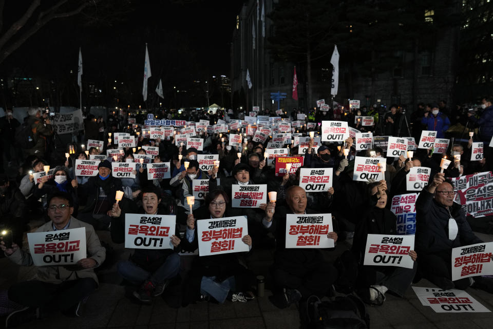 FILE - People shout slogans during a rally against the South Korean government's announcement of a plan over the issue of compensation for forced labors in downtown Seoul, South Korea, on March 6, 2023. South Korean and Japanese leaders will meet in Tokyo on Thursday, March 16, 2023, beginning their first bilateral summit in more than a decade, and hoping to overcome resentments that date back more than 100 years. (AP Photo/Lee Jin-man, File)