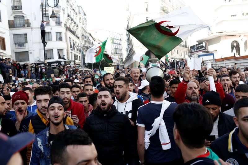 Demonstrators take part in a protest to demand for the presidential election scheduled for next week to be cancelled, in Algiers