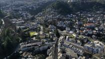 An aerial view of Gjirokastra town, southern Albania, Saturday, Feb. 6, 2021. A dream come true in 2019 was abruptly cut short in 2020 by the pandemic and offers no clear prospects ahead for local residents of Gjirokastra as the UNESCO World Heritage Site calls for tourists' help to cope with the pandemic. (AP Photo/Hektor Pustina)